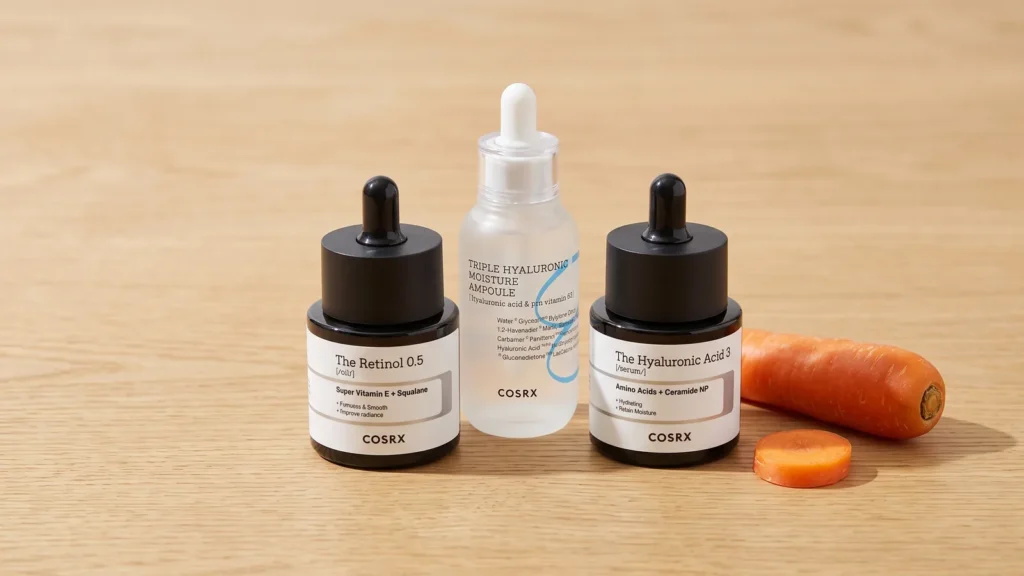 COSRX The Retinol 0.5 Oil aliejinis veido serumas su retinoliu, COSRX The Hyaluronic Acid 3 Serum drėkinamasis serumas ir COSRX Hydrium Triple Hyaluronic Moisture Ampoule drėkinantis serumas – Geriausi odos šviesinimo serumai (korėjietiška kosmetika)